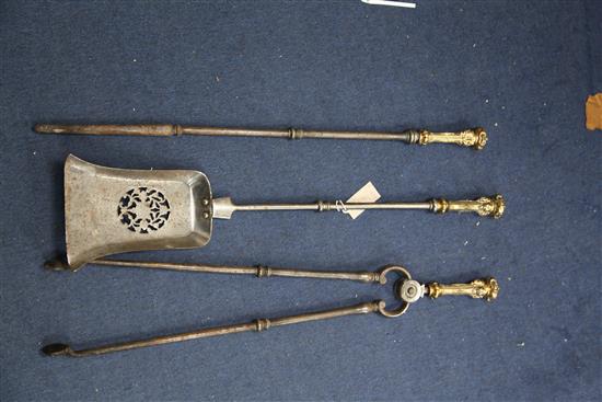 A set of three George III steel and bronze mask handled fire irons